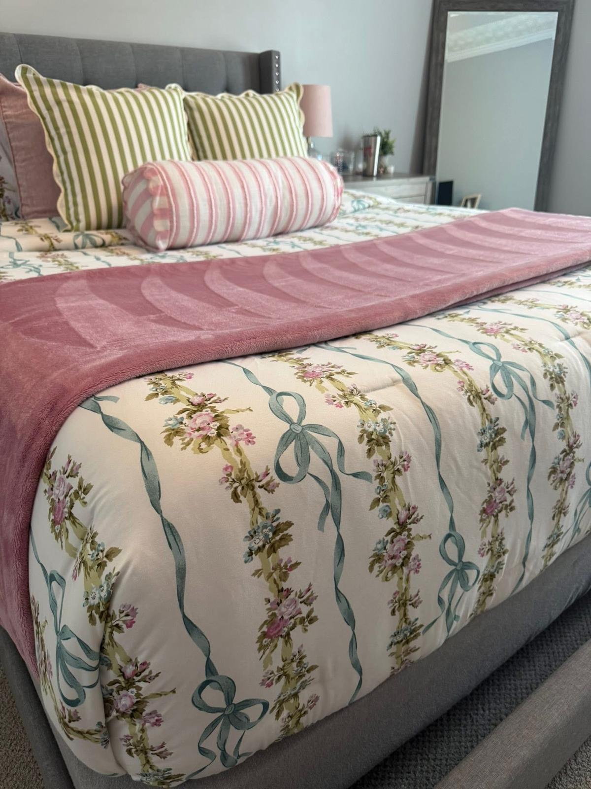 Neatly dressed bed with fresh linens