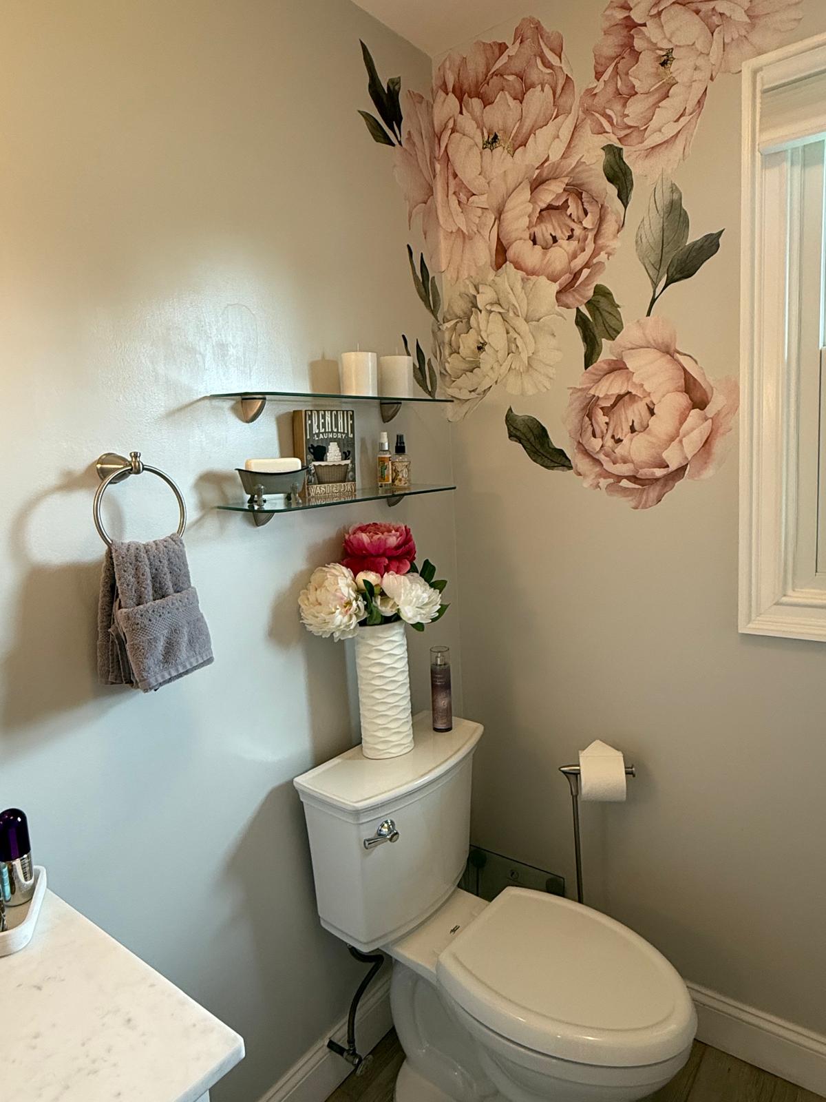Detailed powder room with floral accents