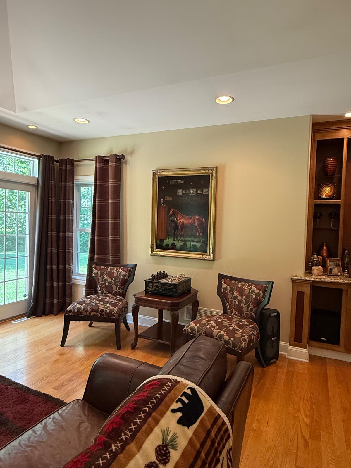 Refined sitting room with hardwood floors