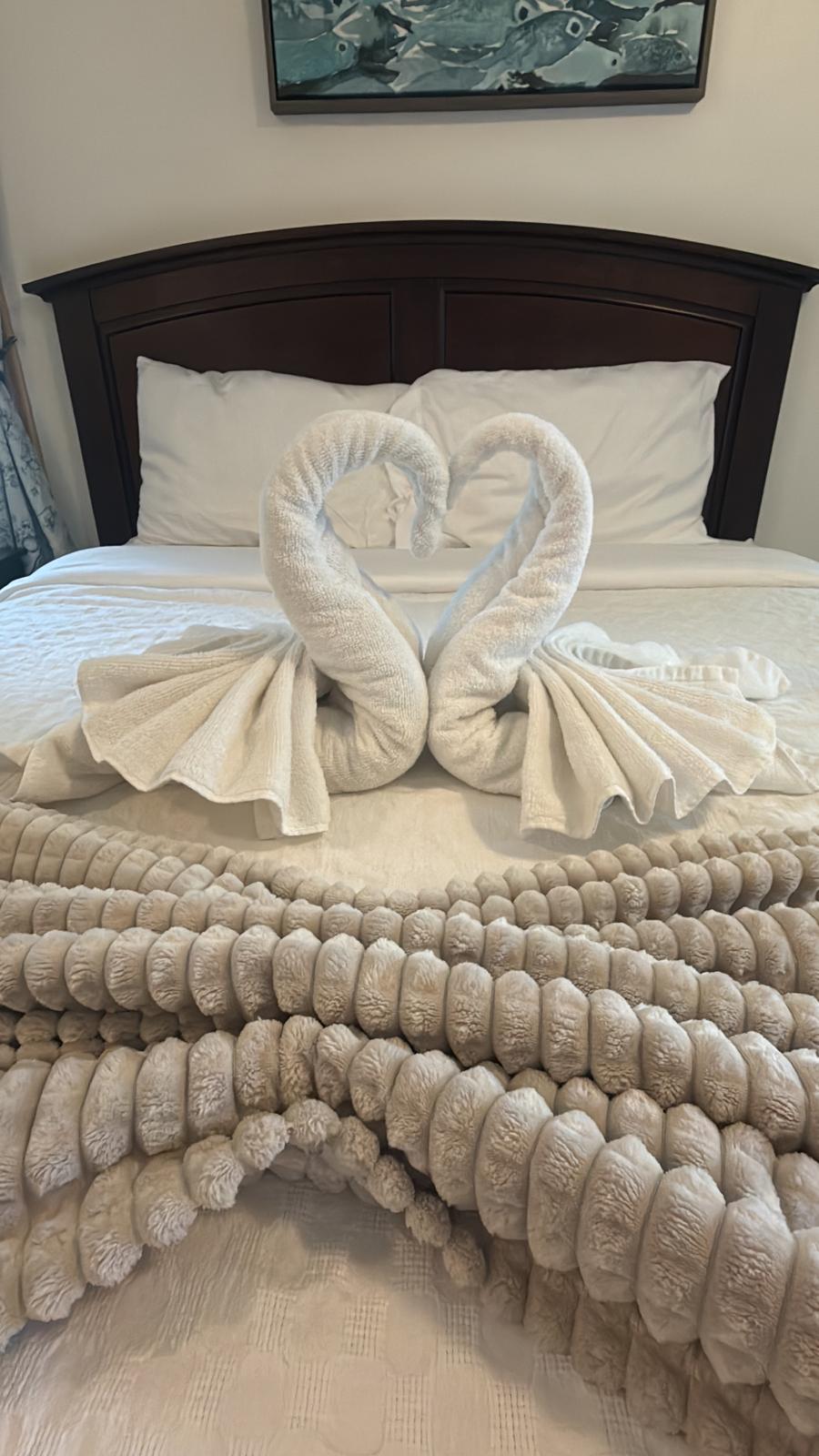 Towel swans on a freshly made bed