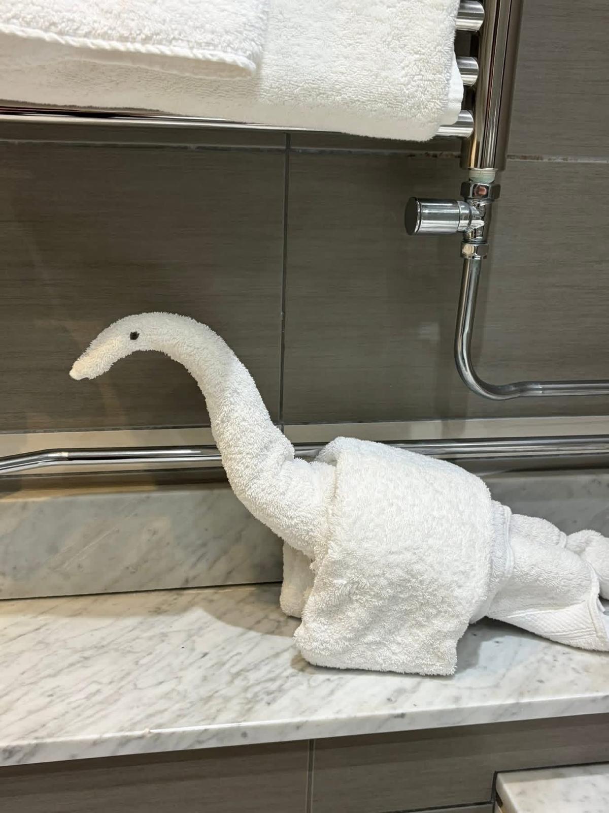 Decorative towel swan on marble vanity